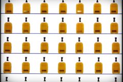 glass bourbon bottles in wall
