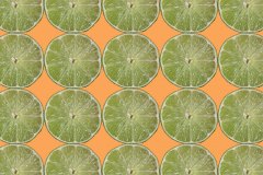 limes on orange background