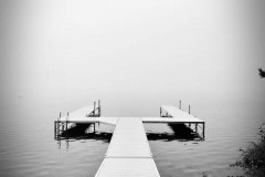 black and white pier and water